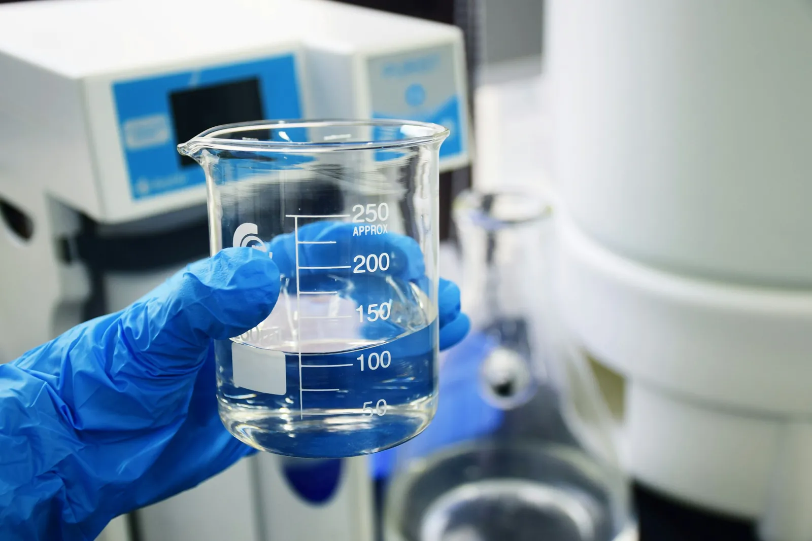 Laboratory beaker held during quality analysis